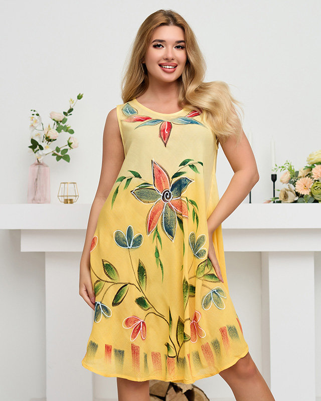 Women's yellow beach cape, a dress with a floral pattern - Clothing