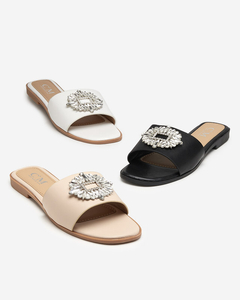 Beige women's slippers with a silver ornament - Footwear