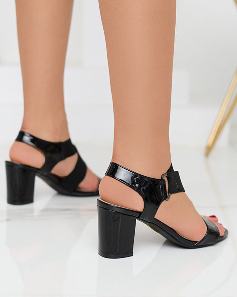 Black lacquered women's sandals on the Wopala post - Footwear