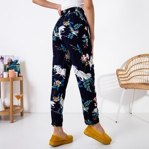 Navy blue women's pants with a floral pattern - Clothing